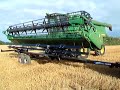 John Deere S690i hillmaster (taking header off)