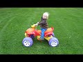 Miles Riding ATV around the back yard