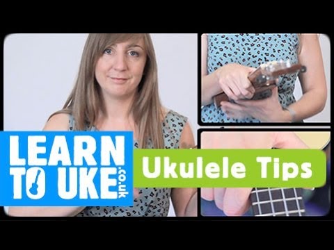 how to hold a ukulele properly