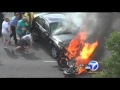Bystanders Rescue Man from Under Burning Car