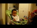 Daddy feeding baby porridge