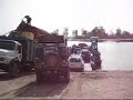 Catching the ferry to cross the Niger river, we had to load Maggie onto the ferry, the 2nd last working one, which broke down half way across.
