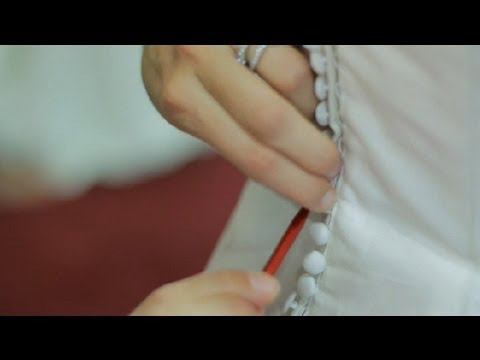 how to fasten buttons on a wedding dress