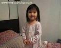 Little Girl telling story Little girl telling us her story about what she heard or saw over and over again This adorable little oriental girl has created her own song and tells the cameraman how it goes I especially like the way she points to her fingers as if in explanation Very cute see more at www freebabyclips com cute cute girl oriental song sing dance at www freebabyclips com