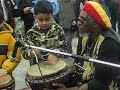 CHILDREN PLAYING DRUMS WITH RAS LEON & QUEEN NZINGHA CHILDREN PLAYING DRUMS WITH RAS LEON & QUEEN NZINGHA