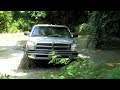 Mudding Silver Lifted Dodge Ram