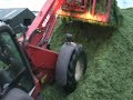 Silage being hauled out in half loads in June 2005 when things were wet and sticky.  Watch out for the man who know the limits of his Manitou ;)