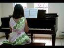Madelyne playing piano
