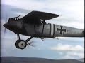 beautiful film with good flying but full of historical inaccuracies (and in this clip, a continuity error):

  at a distance richthofen's plane (he is shown here flying a pfalz) has a black-white-black fuselage band behind the cockpit. closeups however, show a checkerboard band painted on the fuselage behind him. when he climbs out after landing (a closeup) the fuselage band is black-white-black...

   historical errors of the film:

  1) the fokker d.vii arrived late in the war -early 1918- and would not have been found at richthofen's first unit as seen in the film.

 2) richthofen never served in the same unit at the same time with hermann g�ring as portrayed in this movie. i've not seen evidence they ever even met. g�ring did take command of jg 1 (richthofen's squadron) months after richthofen's death. 

 3) lanoe hawker was flying a pusher-type dh-2 not an s.e.5a when downed by richthofen, who was himself flying an albatros d.ii, not the fokker d.vii used in the film. 

4) the ending: latest research appears to point to an australian machine-gunner  -several hundred yards away and to the side of richthofen's path of flight- as being the one who fired the fatal shot.