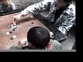 Tibetans playing Korem / carrom Tibetans playing Korem / carrom