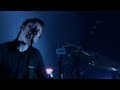 if you want the original movie - it didn't translate too well to youtube:
http://rapidshare.com/files/53689680/radiohead_-_planet_telex__live_at_coachella_2004_.avi
you'll probably need vlc ( http://www.videolan.org/vlc/ ) to get the sound to work.