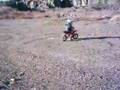 Caleb riding his new pocket dirt bike