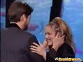 alicia silverstone presenting award to jim carrey. kisses her onstage