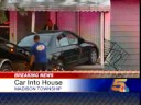 Woman Crashes Car into House