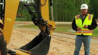 Learn how to operate the Dual Lock mechanism in your Cat backhoe loader's quick coupler. 