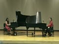 jonathan & jennifer mason perform variations on a theme by paganini by witold lutoslawski in a piano duo recital at university of central florida's rehearsal hall on december 8, 2007.