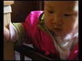 Baby Natalie standing in her crib