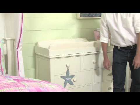 how to fasten changing pad to dresser