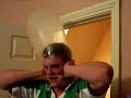 Lilly Blowing up a condom on his head