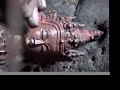 Carving of a tibetan Buddha statue  - www.Buddhafiguren.de