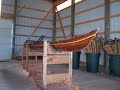 Photos showing several steps in the construction of a wood strip Kayak