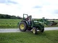 Grayson riding the tractor