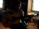 Chela playing her guitar