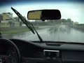 Honda Civic aquaplanes on a wet circuit and crashes