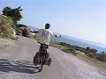 Thomas cycling down a small coast road between Split and Dubrovnik 