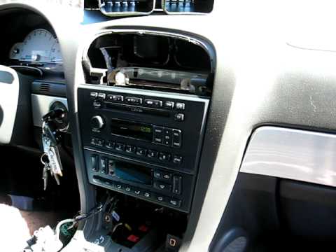 How to Remove Radio / CD Changer from 2002 Ford Thunderbird for Repair.