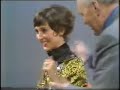 david nixon and ali bongo apparently pulling anita harris through the centre hole of a giant chinese coin in the early 70s.