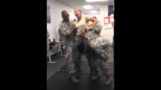 Female soldier squeezes her partner's testicles