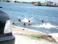 Illegal Philippines immigrants swimming naked