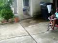 tanisha ridng a tricycle then crashing
