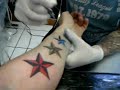 Having new tattoo done
