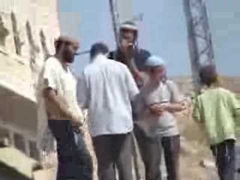 Hebron - Settlers at the door of a ...