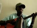 papis sings a bit of acoustic wolof in uni halls in dakar, senegal