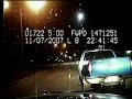Cops chase a car-jacked pickup truck along the highway.
