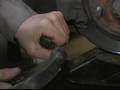 How to Repack Grease & Adjust Wheel Bearing in Cars : How to Remove Brake Calipers on Cars