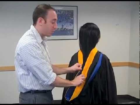 how to fasten graduation gown