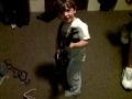 kid playing guitar with daddy. (2yrs old)