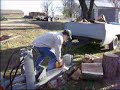 Log splitter that my dad and I built during the winter of 2005. I am splitting pecan, and you can see, it was a big tree. It was 42 inches in diameter at the base, and the trunk was at least 30 feet tall to the first limb.