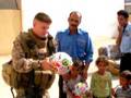 Marines pass out donated soccer balls to Iraqi kids