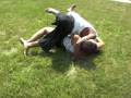 Adrienne and Marcus fighting in the yard