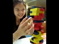 Julie playing Jenga