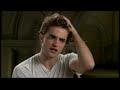 A brief interview with actor Robert Pattinson, where he answers questions about his upcoming film, The Twilight Saga: New Moon. The film is set to be released on November 20, 2009. - On his character. - On the film's plot. - On the inciting incident. - On the introduction of the Volturi. - On working with the director, Chris Weitz. - On the difference between Edward and Jacob. - On the multitude of fans watching filming. - On what Edward learns in the film. - On the increased scale of the ...