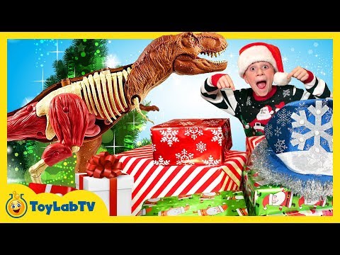 Christmas for the Dinosaurs! Opening Dinosaur Presents from Santa & Jurassic World Surprise Toys