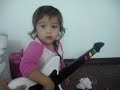 1 year old girl playing guitar hero