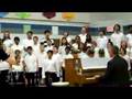 Ian Lane singing with Mosby Woods Elementary School Choirs