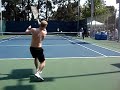 Marat Safin hitting the ball to the Grandstand court
